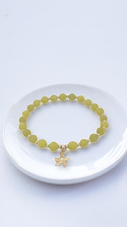 Green Olive Jade Beaded Stretch Bracelet with Gold Starfish Charm from Sparks and Gem